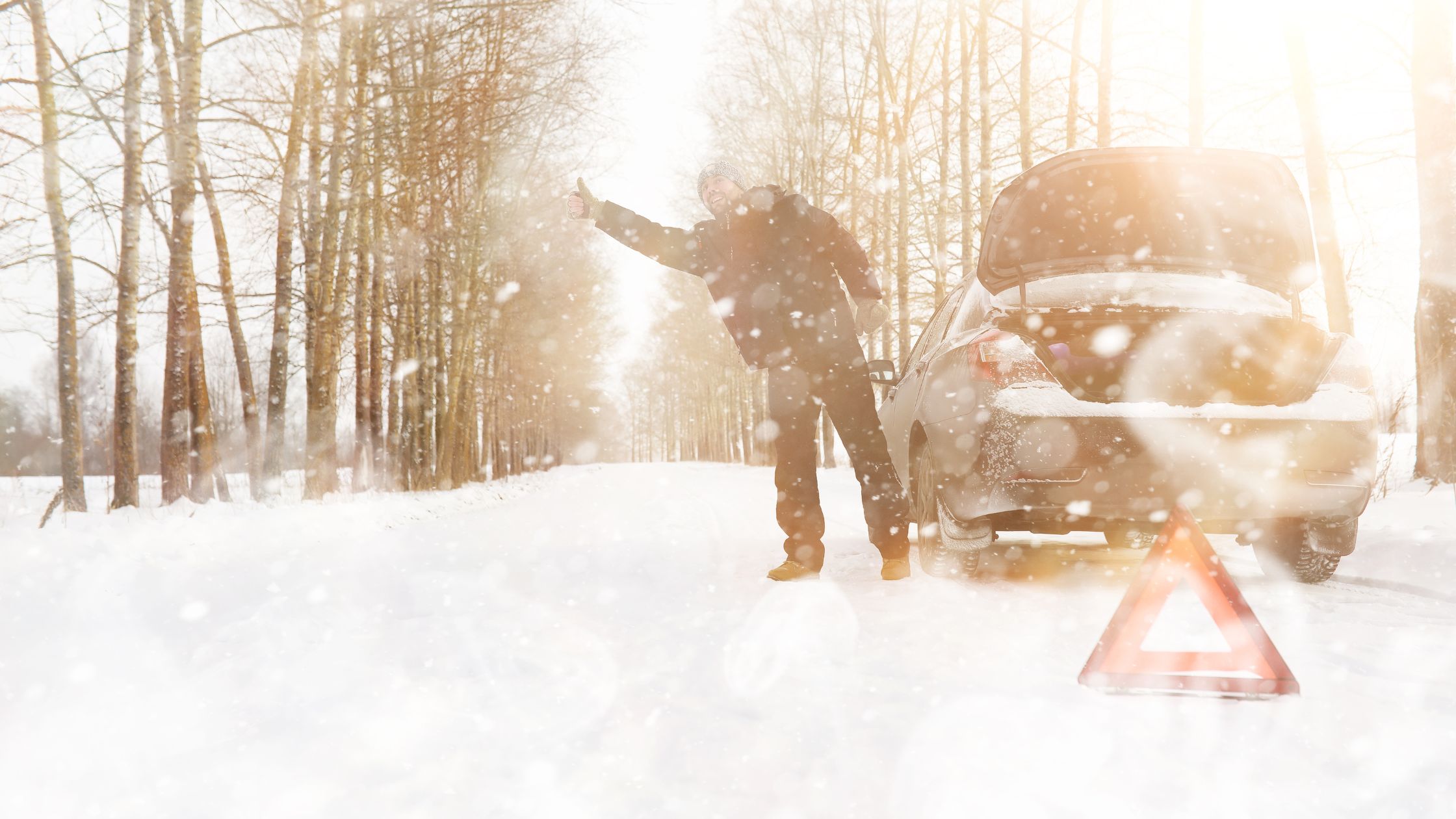 car broken down on the side of the road in the winter